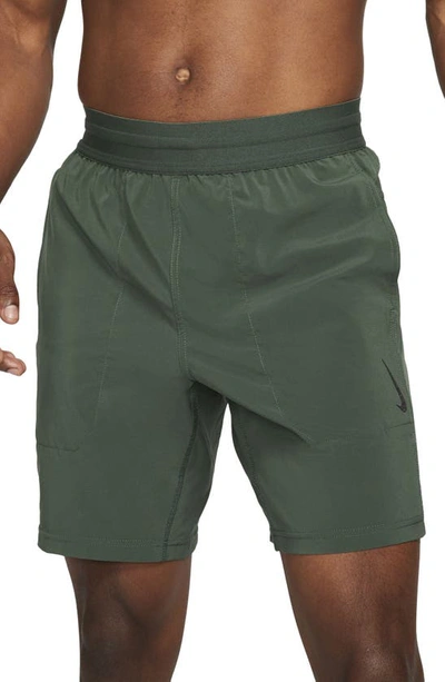 Shop Nike Dri-fit Flex Pocket Yoga Shorts In Galactic Jade