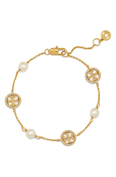 Shop Tory Burch Pave Logo Bracelet In Tory Gold/ Crystal/ Pearl