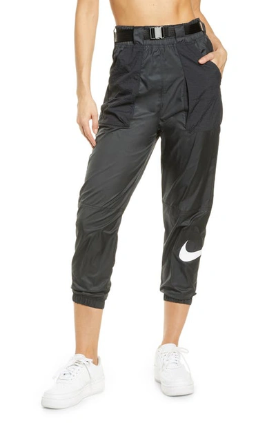 Shop Nike Woven Swoosh Pants In Black/ White