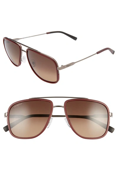 Shop Ferragamo 57mm Navigator Sunglasses In Matte Ruthenium/ Red