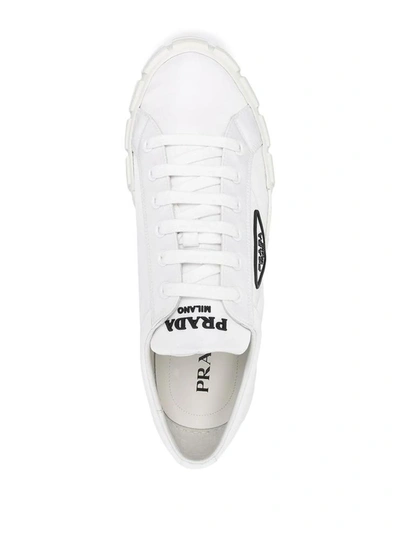 Shop Prada Wheel Cassetta Low-top Sneakers In Bianco+nero