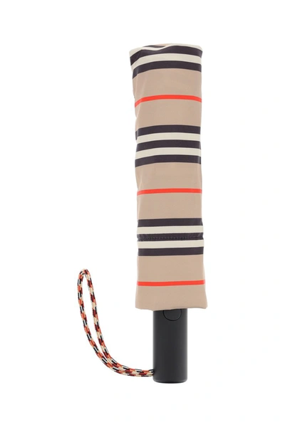 Shop Burberry Icon Stripe Folding Umbrella In Archive Beige