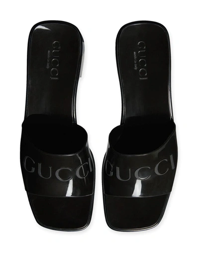 Shop Gucci Logo Embossed Sandals In Brown