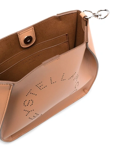 Shop Stella Mccartney Perforated Logo Shoulder Bag In Rose Camme