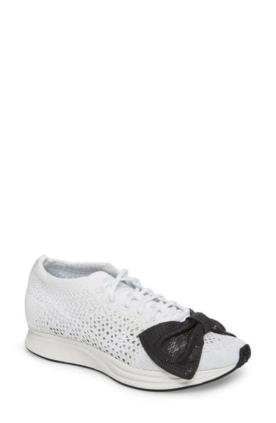 Shop Comme Des Garçons X Nike Bow Flyknit Racer Sneaker In White