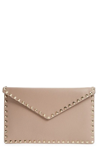 Shop Valentino Rockstud Leather Envelope Pouch In Poudre