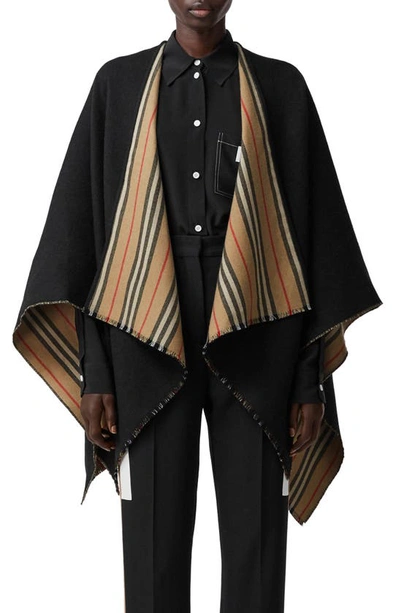 Shop Burberry Icon Stripe Reversible Wool Cape In Black/ Arc Beige