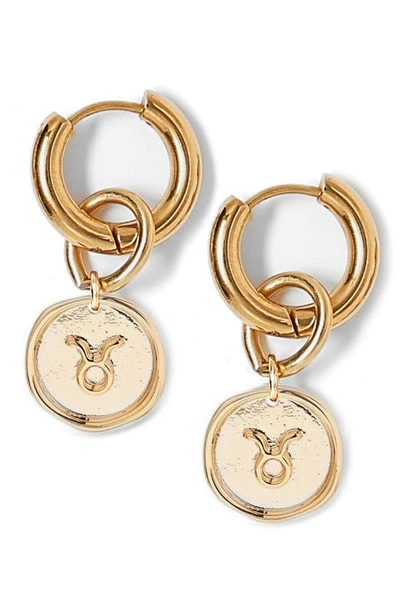 Shop Tess + Tricia Zodiac Drop Huggie Hoop Earrings In Gold - Taurus