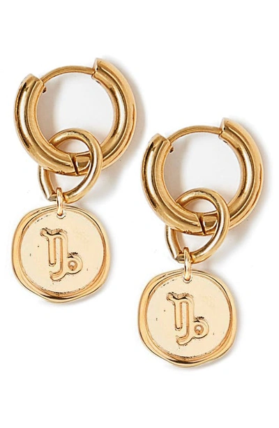 Shop Tess + Tricia Zodiac Drop Huggie Hoop Earrings In Gold - Capricorn