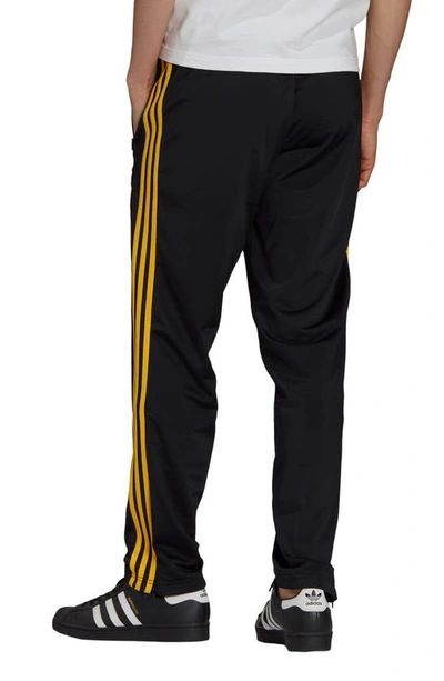 Shop Adidas Originals X The Simpsons Firebird Track Pants In Black/ Superyellow