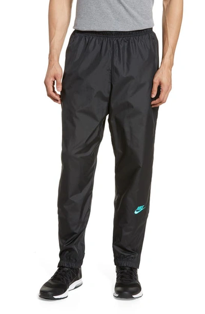 Shop Nike Track Pants In Black/ Hyper Jade