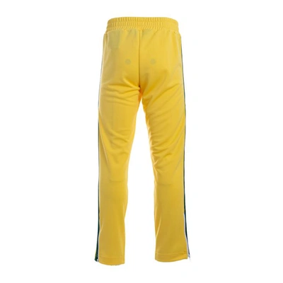 Shop Palm Angels Trousers In Yellow - Green