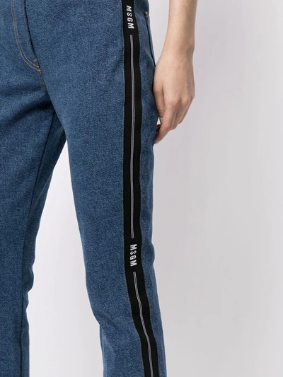 Shop Msgm Cropped Logo Tape-detail Straight-leg Jeans In Medium Blue