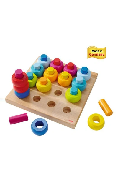 Shop Haba Rainbow Whirls Pegging Game In Yellow/ Blue/ Green And Pink