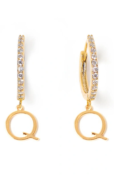 Shop Tess + Tricia Initial Huggie Hoop Earrings In Gold Q