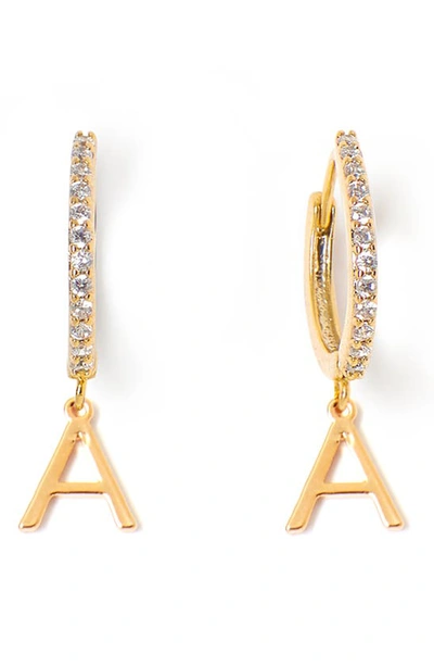 Shop Tess + Tricia Initial Huggie Hoop Earrings In Gold A