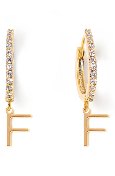 Shop Tess + Tricia Initial Huggie Hoop Earrings In Gold F
