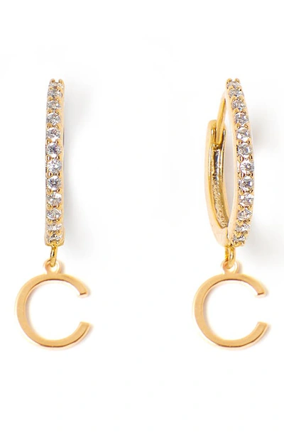 Shop Tess + Tricia Initial Huggie Hoop Earrings In Gold C