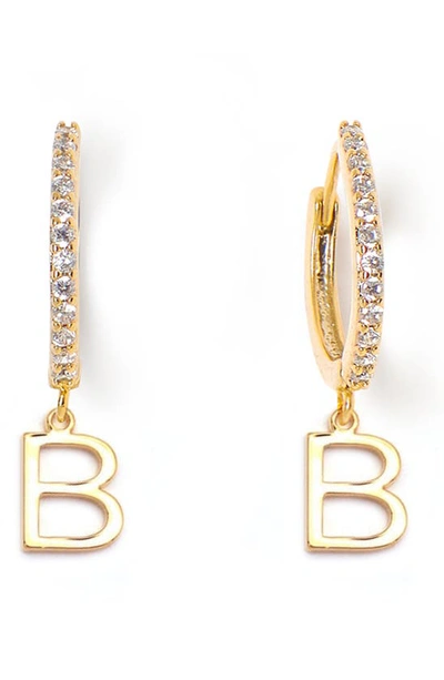 Shop Tess + Tricia Initial Huggie Hoop Earrings In Gold B