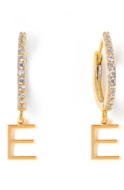 Shop Tess + Tricia Initial Huggie Hoop Earrings In Gold E