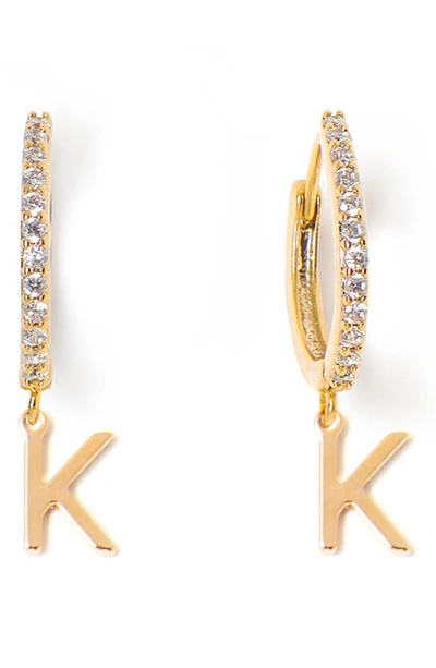Shop Tess + Tricia Initial Huggie Hoop Earrings In Gold K