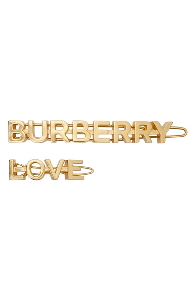 Shop Burberry Love Set Of 2 Hair Clips In Gold
