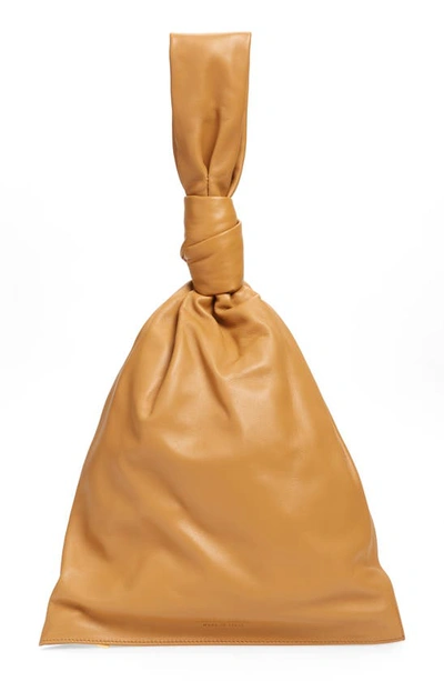 Shop Bottega Veneta Twist Leather Handbag In Caramel/ Gold