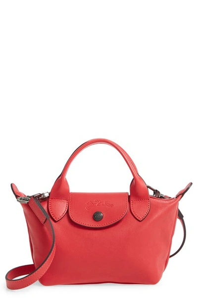 Shop Longchamp Mini Le Pliage Cuir Leather Top Handle Bag In Red