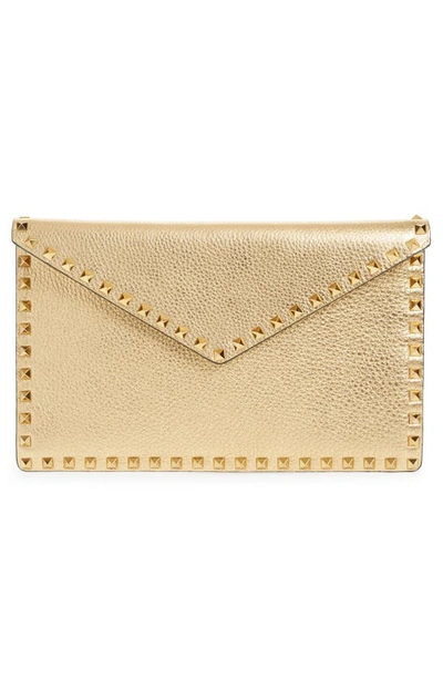 Shop Valentino Large Rockstud Metallic Leather Envelope Pouch In Antique Brass