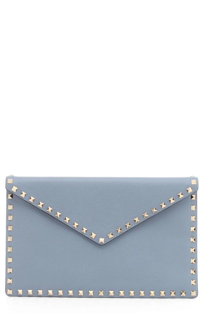 Shop Valentino Rockstud Leather Envelope Pouch In Niagara