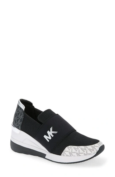 Shop Michael Michael Kors Felix Slip-on Sneaker In Black/ White