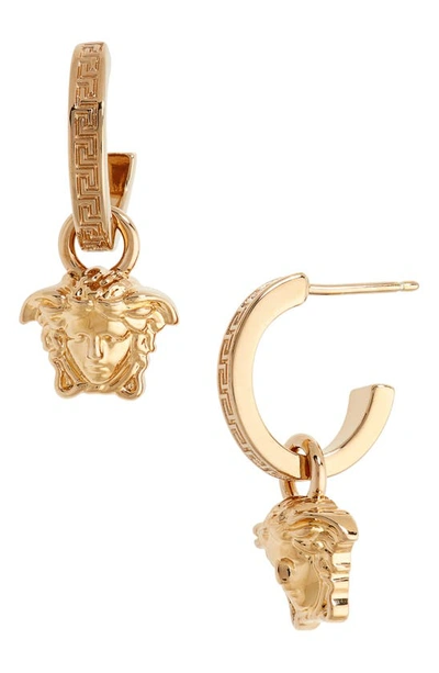 Shop Versace Medusa Huggie Hoop Earrings In Gold