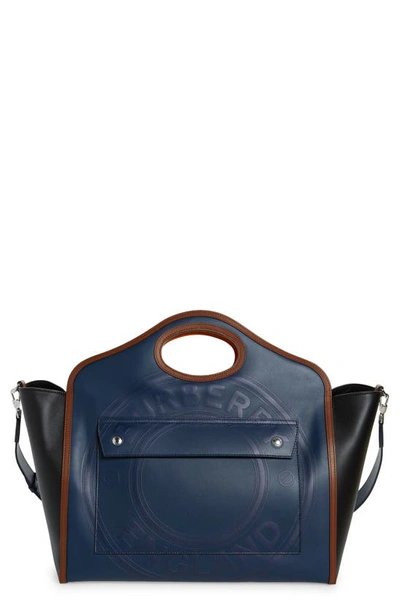 Shop Burberry Medium Pocket Logo Embossed Leather Bag In Ink Blue/ Black