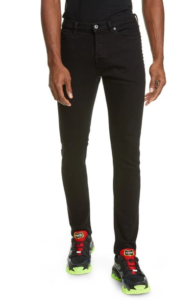 Shop Valentino Rockstud Skinny Jeans In Black