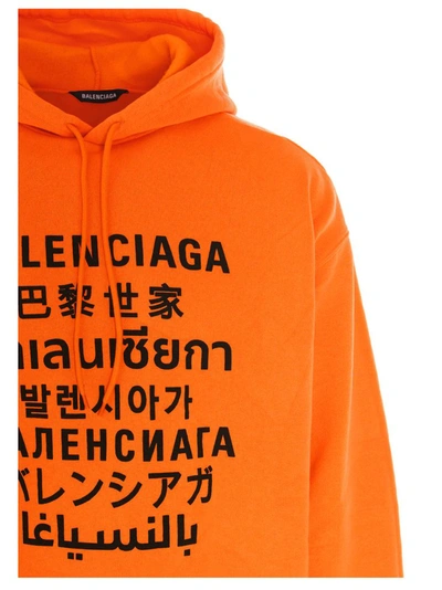 Shop Balenciaga Languages Print Hoodie In Orange