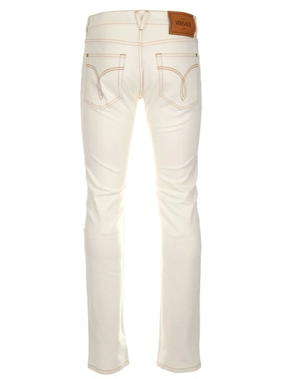 Shop Versace Mid Rise Straight Leg Jeans In White