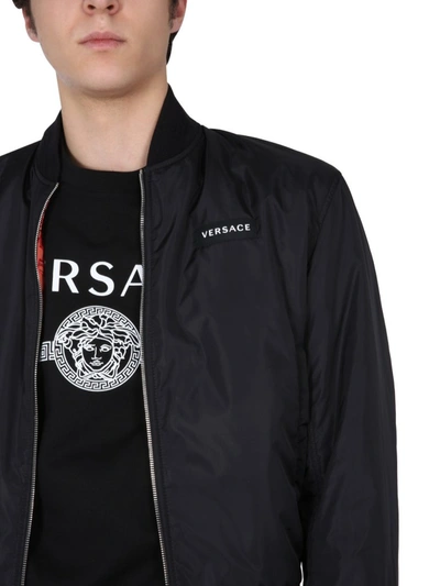 Shop Versace Reversible Bomber Jacket In Multi