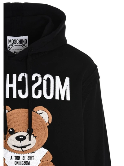 Shop Moschino Inside Out Teddy Hoodie In Black