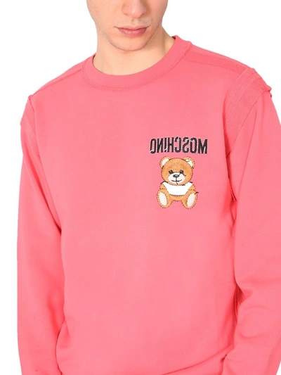Shop Moschino Inside Out Teddy Sweatshirt In Pink