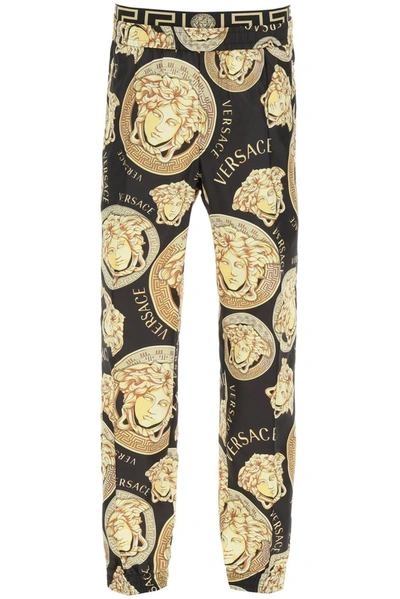 Shop Versace Graphic Print Track Pants In Multi