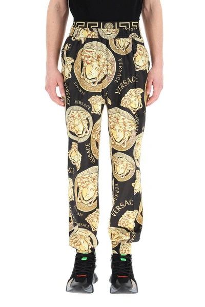 Shop Versace Graphic Print Track Pants In Multi