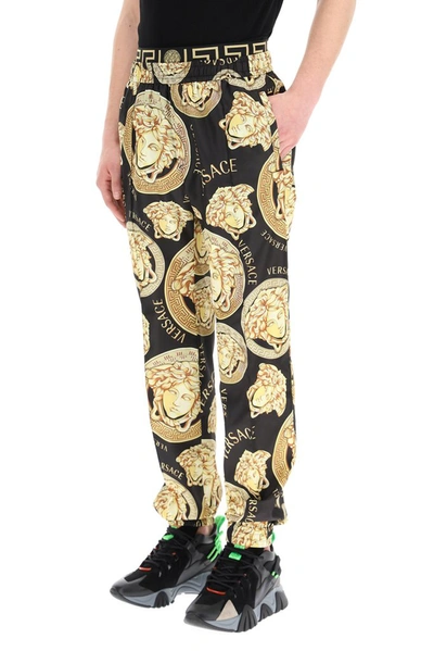 Shop Versace Graphic Print Track Pants In Multi