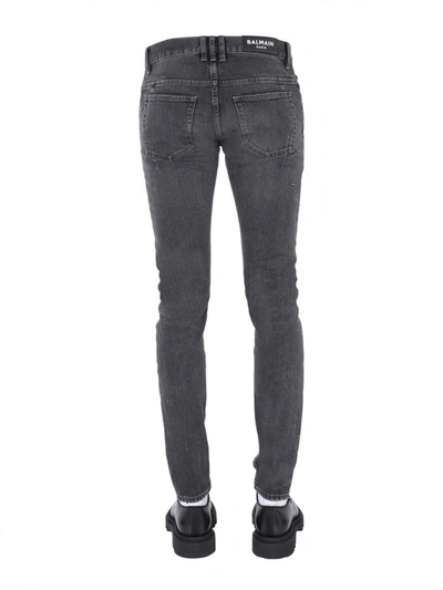 Shop Balmain Distressed Skinny Jeans In Black