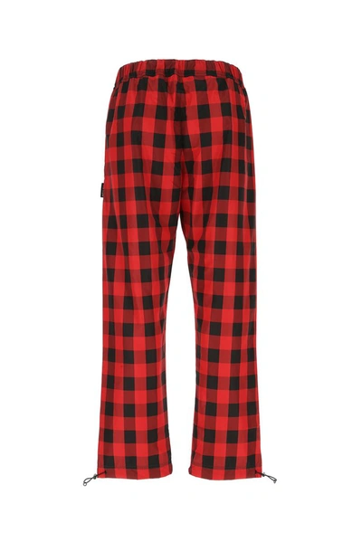 Shop Palm Angels Buffalo Check Pants In Red