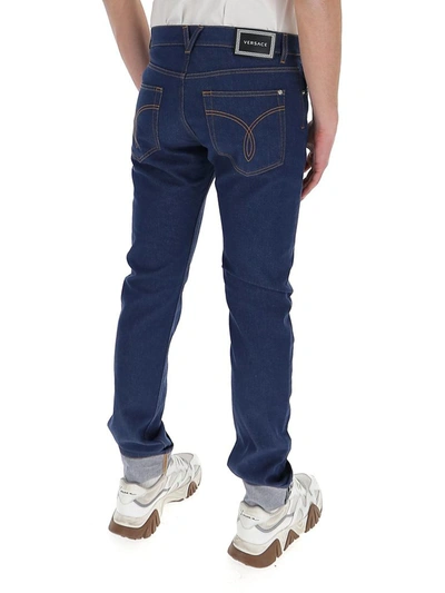 Shop Versace Straight Leg Jeans In Navy
