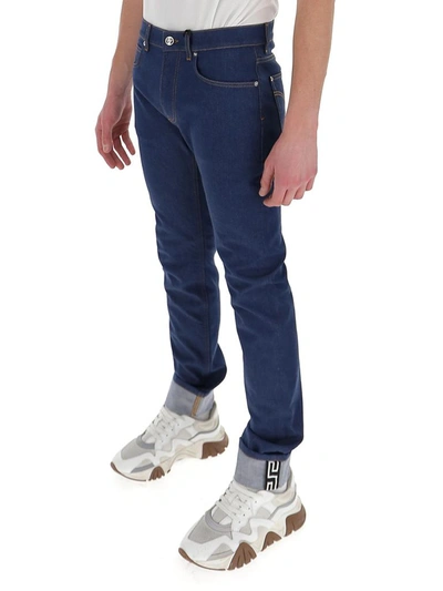 Shop Versace Straight Leg Jeans In Navy