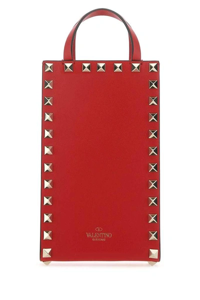 Shop Valentino Garavani Rockstud Mini Top Handle Bag In Red