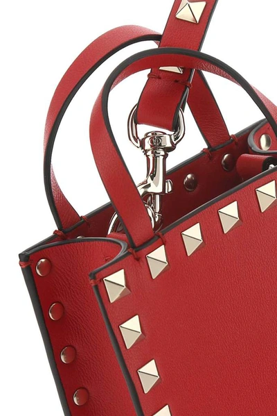 Shop Valentino Garavani Rockstud Mini Top Handle Bag In Red