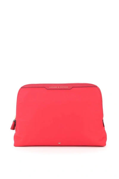 Shop Anya Hindmarch Lotions And Potions Clutch In Pink