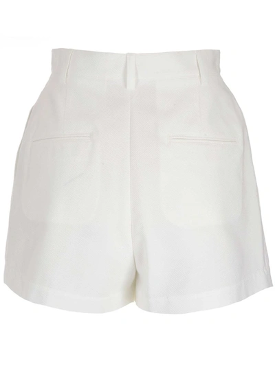 Shop Alaïa High Waisted Shorts In White